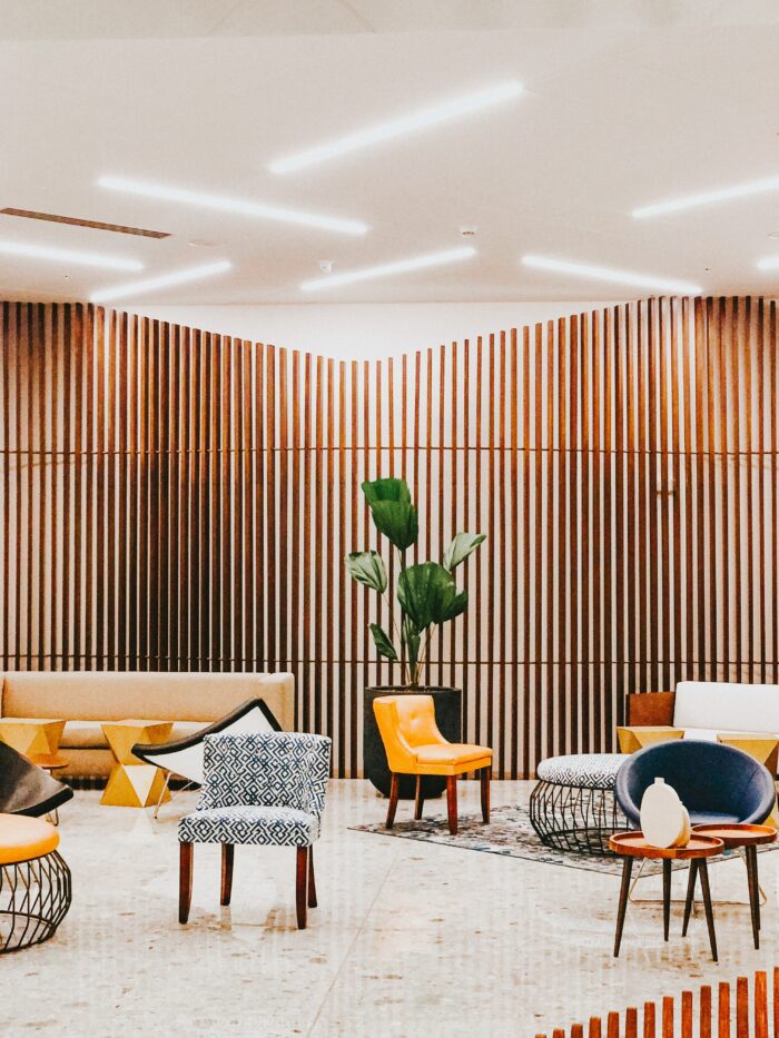 Employee Break room with comfortable seating and a large potted plant.