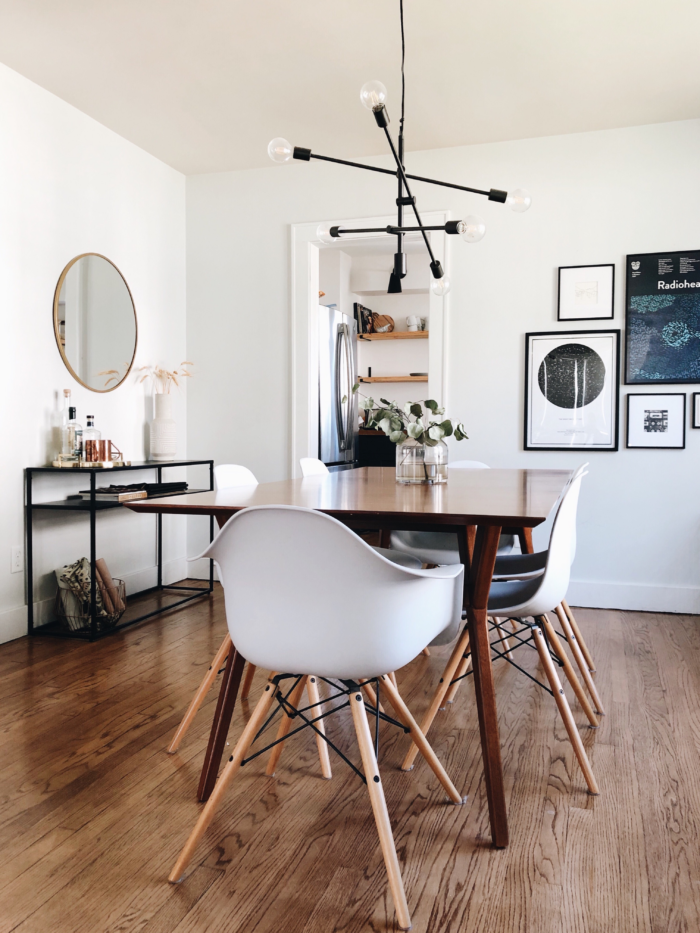 Midcentury modern decor with framed art prints and table.