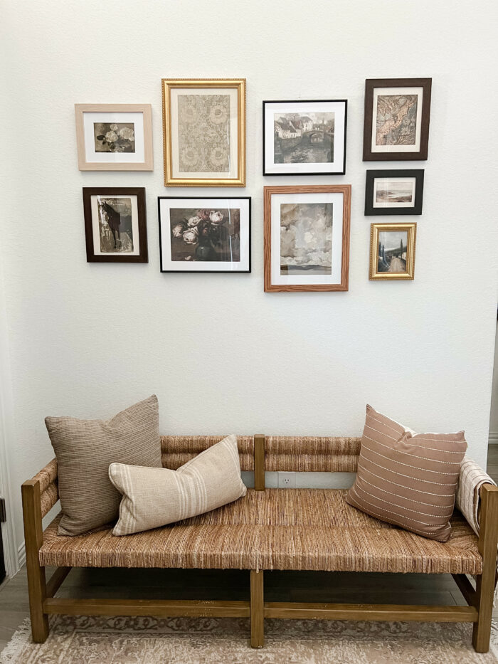 Decor Dilemma: A sitting area with a staggered gallery of mixed frames.
