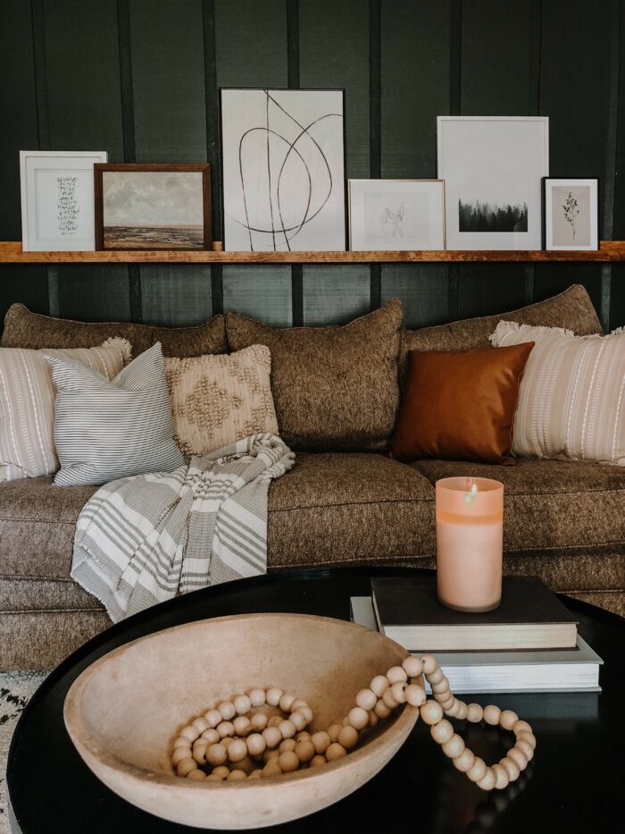 Book Nooks & Reading Corners: A comfy couch with a floating shelf gallery wall. 