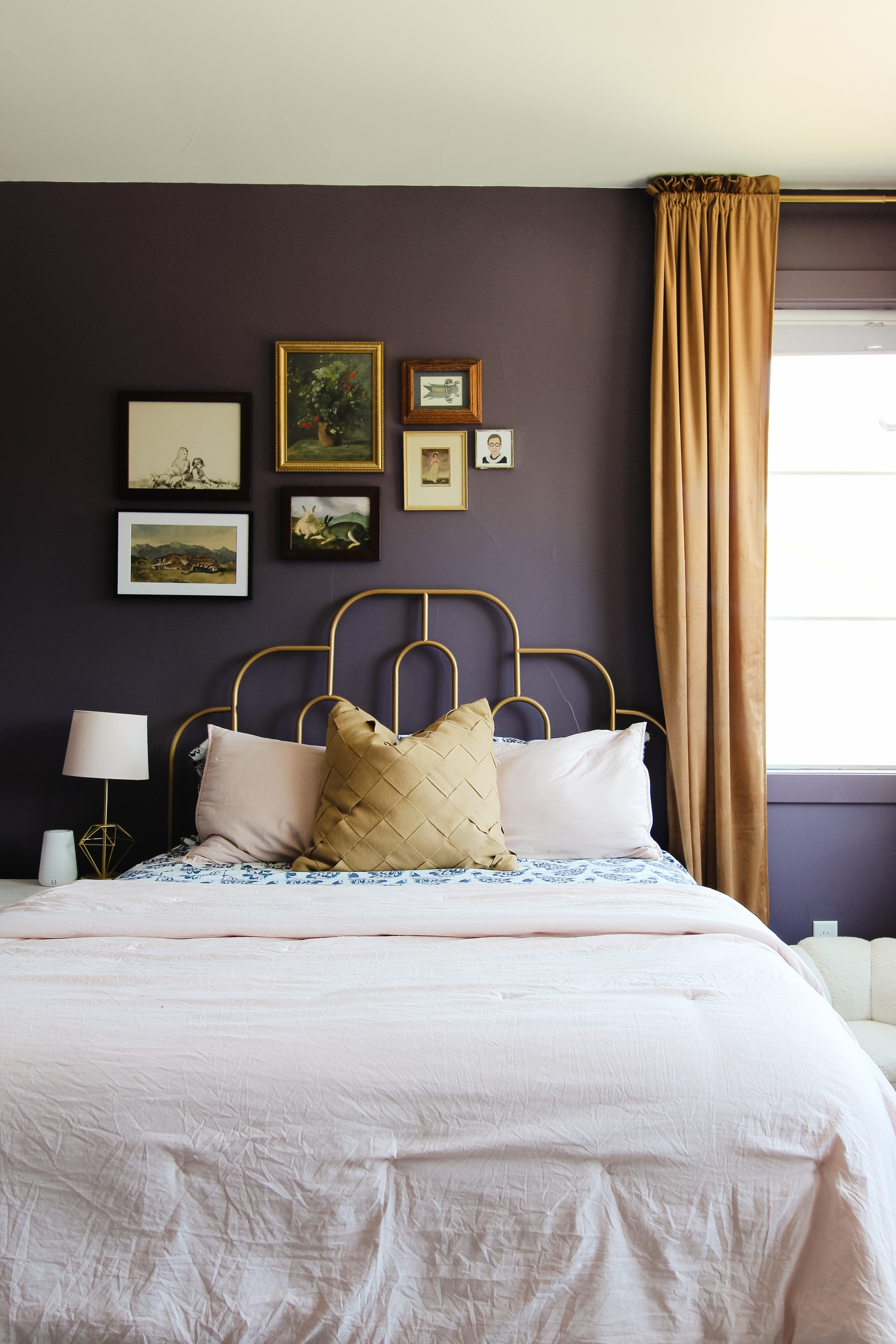 The Ultimate Renter Decor Guide: Damage Free Hanging - A dark purple bedroom