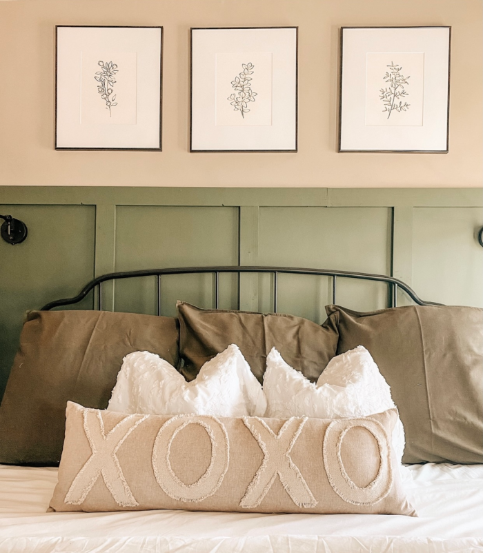 Modern farmhouse decor with art prints and throw pillows.