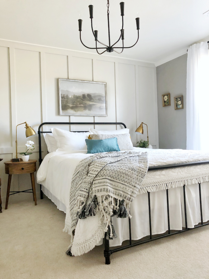 4 Genius Airbnb Design Tips: Bedroom with framed art print.
