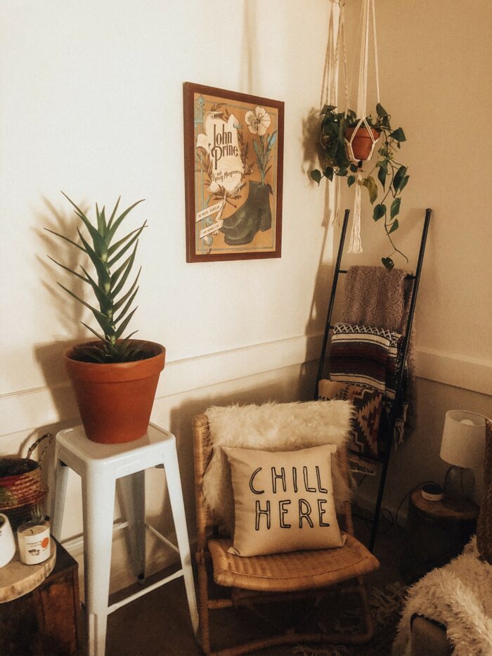 Book Nooks & Reading Corners: A Boho-style reading nook with potted plants and several wool blankets. 
