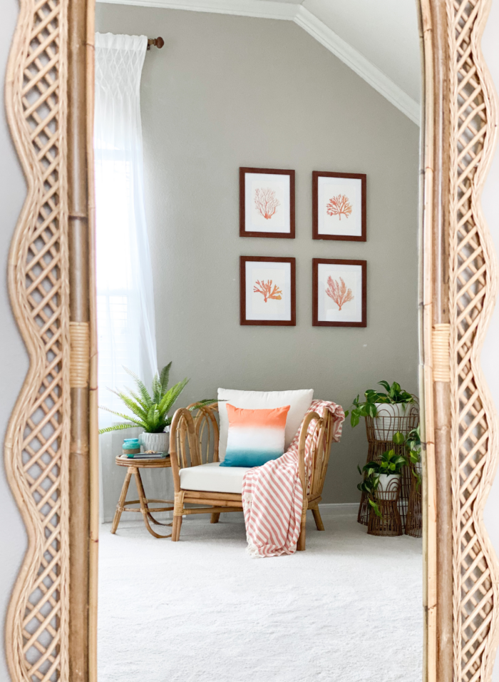 Hotel Room Decoration: A chair with framed artwork hanging above it