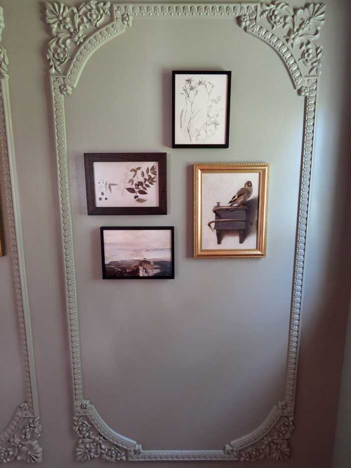 Victorian & Gothic Home Decor Guide: A gray ornate wall paired with fames. 