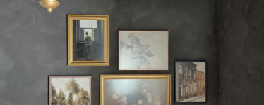 gallery wall with gold picture frames