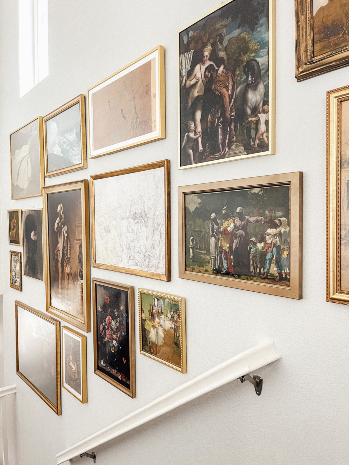 Fine art framing featuring gallery wall above a staircase