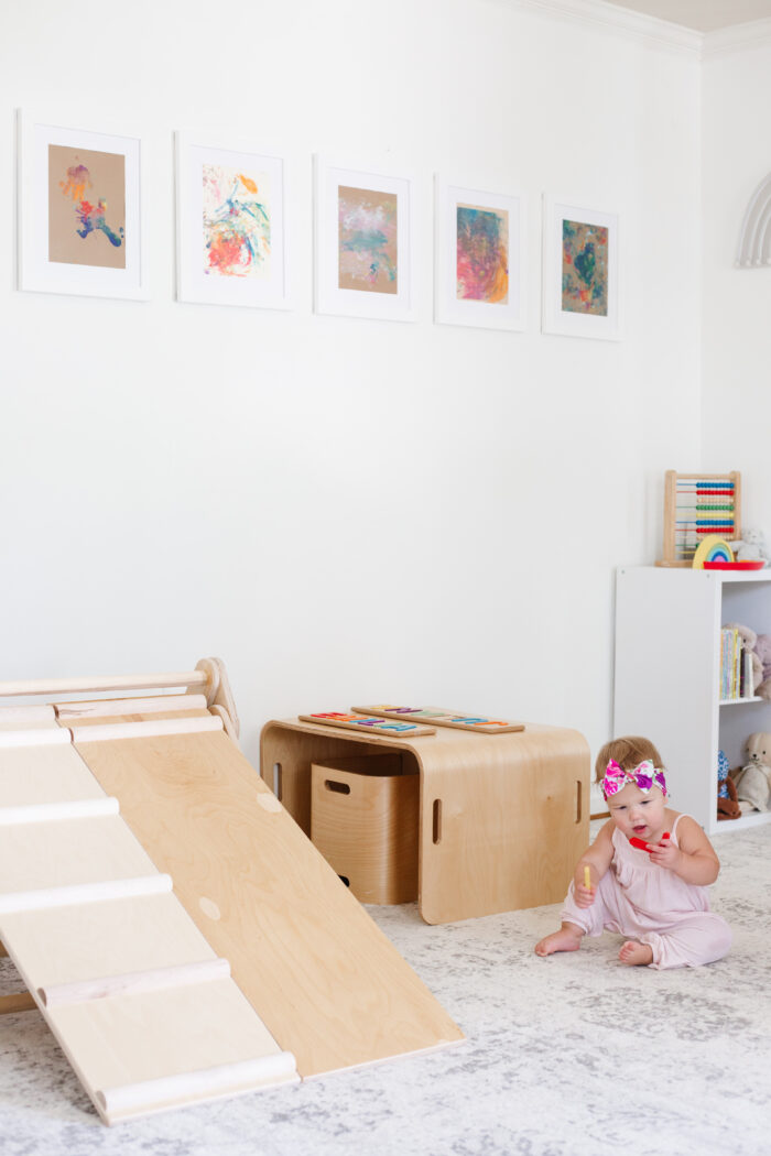 Framing Children's Art: A clean style playroom with fingerpaint artwork.