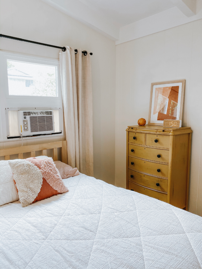 The Ultimate Renter Decor Guide: Damage Free Hanging - A bedroom with a window shaker