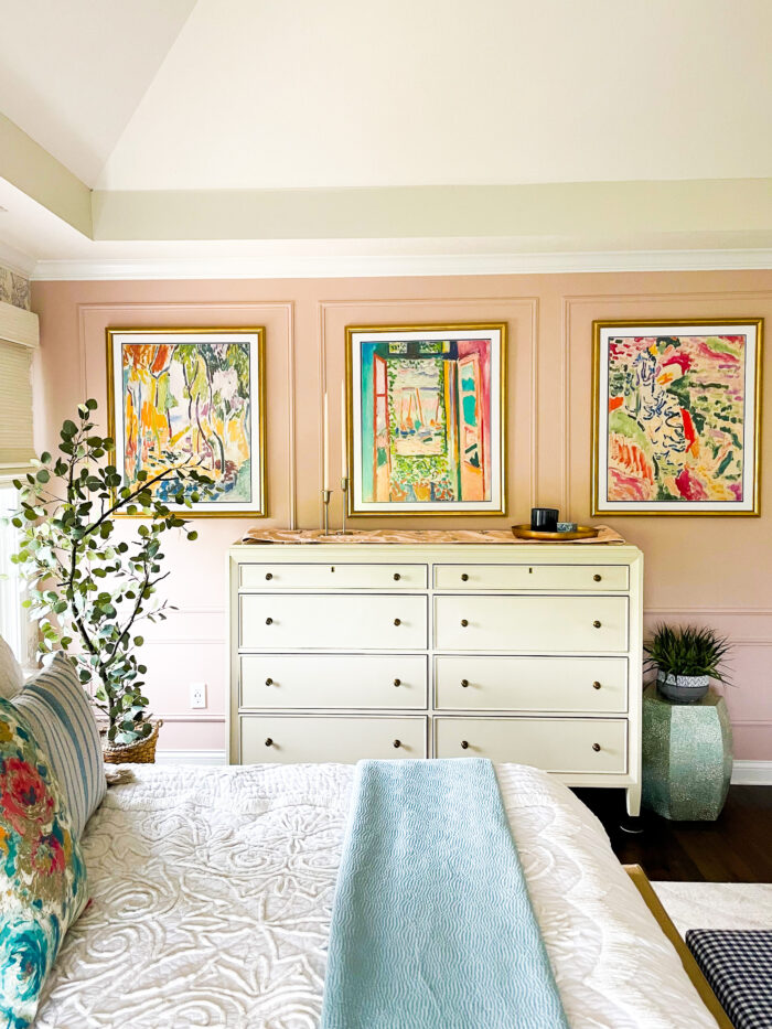 The Complete DIY Wall Repair Guide: A bedroom with baby pink walls and Granby in Gold frames.