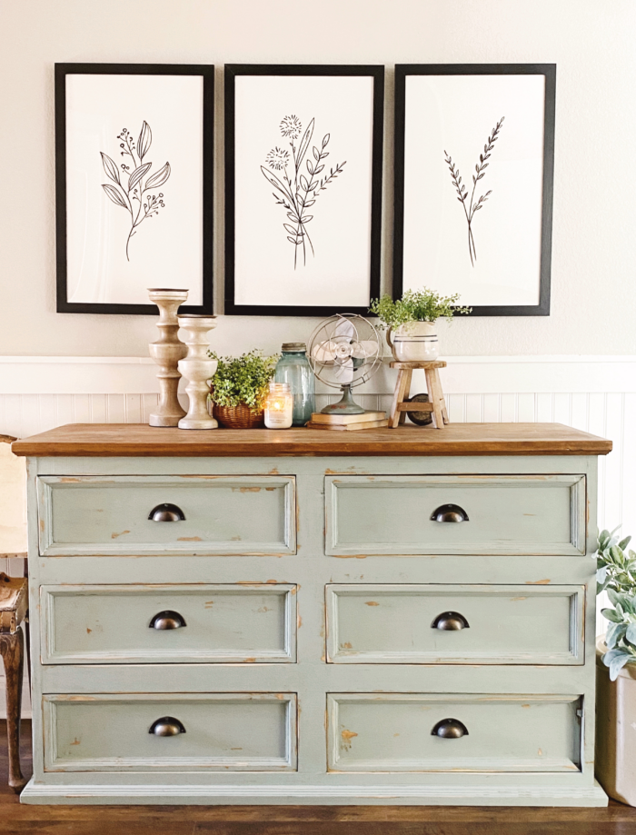 Modern Farmhouse Decor - Framed art prints and a dresser.