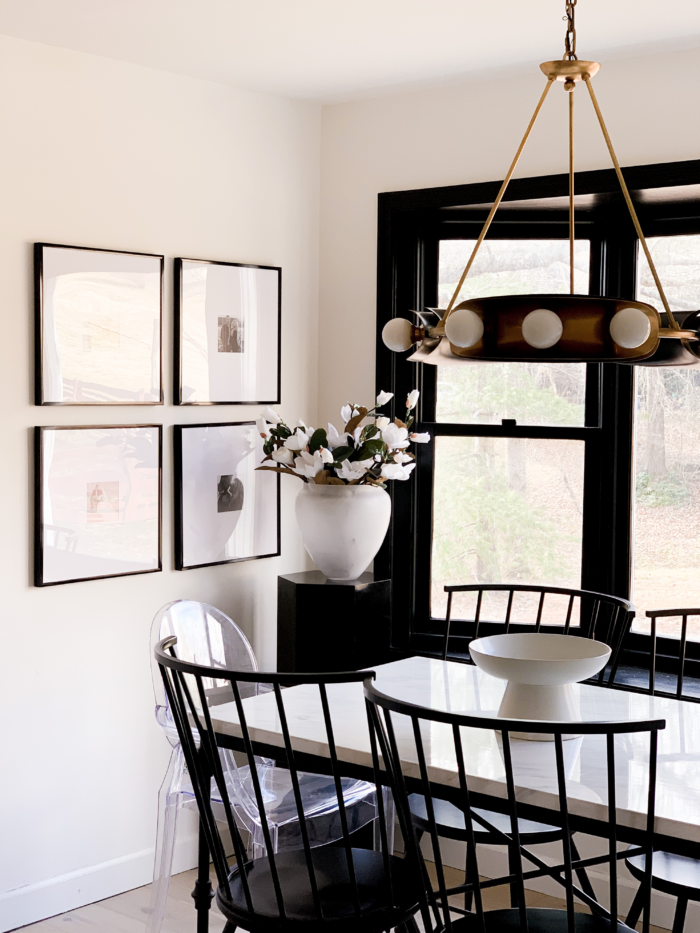 Modern Farmhouse Decor - Framed prints in front of a table and chairs.