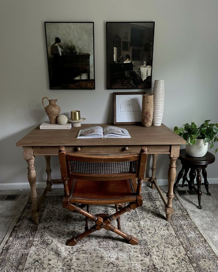 Victorian & Gothic Home Decor Guide: A dark wooden desk paired with framed wall decor.