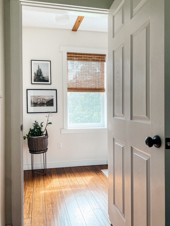 The Ultimate Renter Decor Guide: Damage Free Hanging -  A bedroom with a wooden window fixture