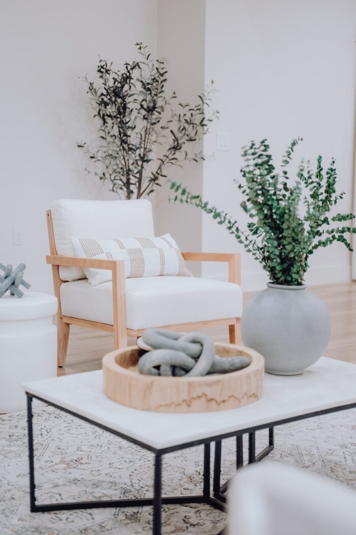 Modern Farmhouse Decor - White chair in a room with a coffee table.