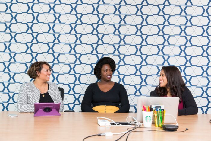 10 Creative Employee Appreciation Gift Ideas 1 3 women working at a table with their computers.