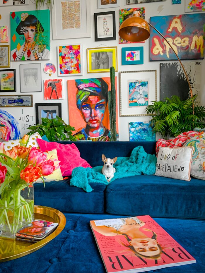 Eclectic decor with a gallery wall of colorful framed art prints.