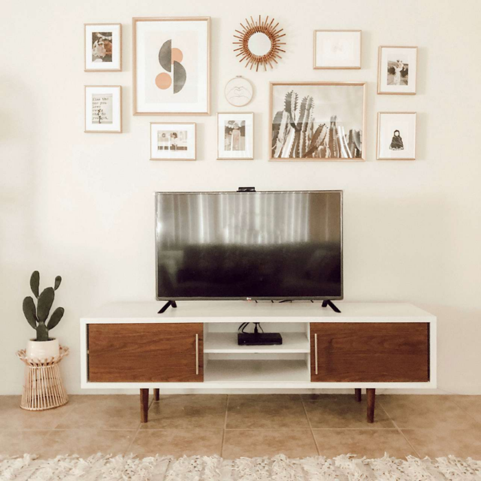 Midcentury modern decor with framed art prints above a TV.