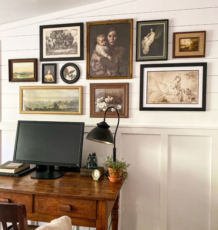 Traditional Decor Ideas - A staggered gallery wall with black and gold frames in a traditional office.