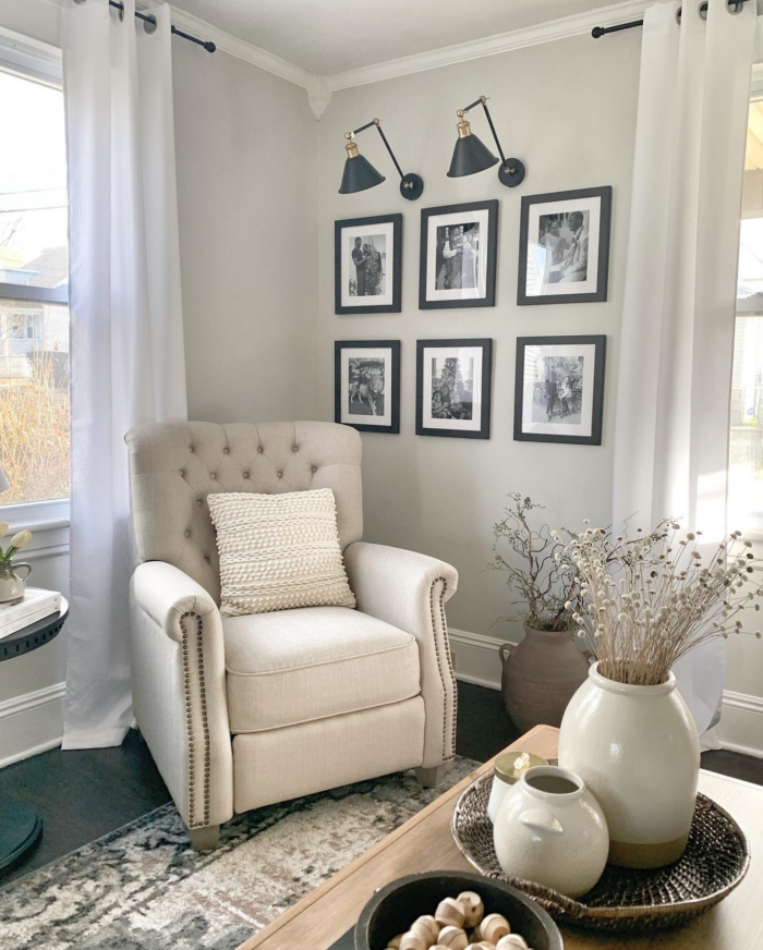 Stunning Traditional Office Decor Ideas: Neutral colored chair below framed photos.
