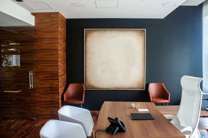 Corporate art framed in a modern office.