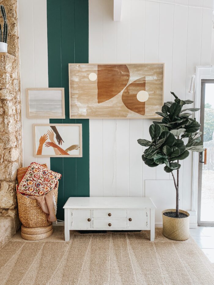 Alternative Living & Functional Framing: An entryway with wood-paneled walls and a small gallery wall. 