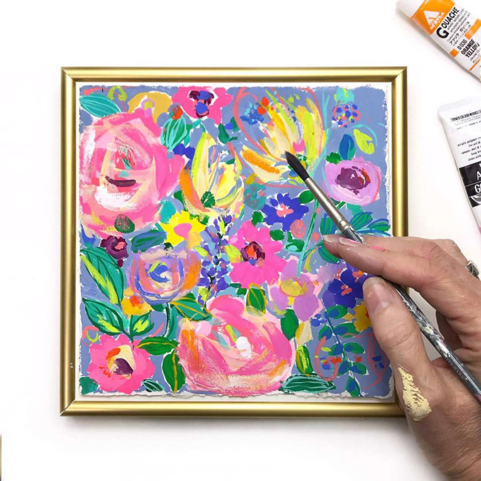 A framed, colorful painting.