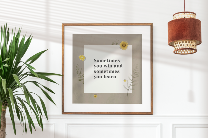 Framed quote next to a plant