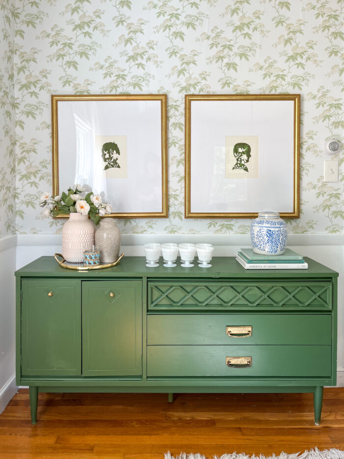a large pair of frames over a green cupboard