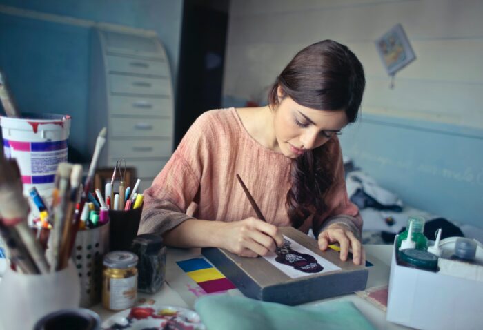 A lady painting in her studio