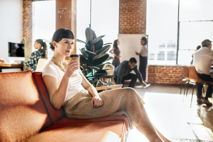 Employee Appreciation Gift Ideas: A woman enjoying her break room with coffee