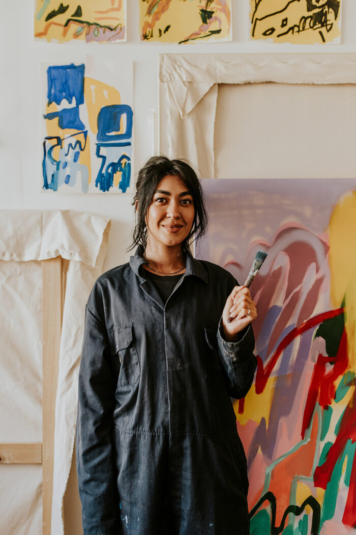 An artist holding a paintbrush 