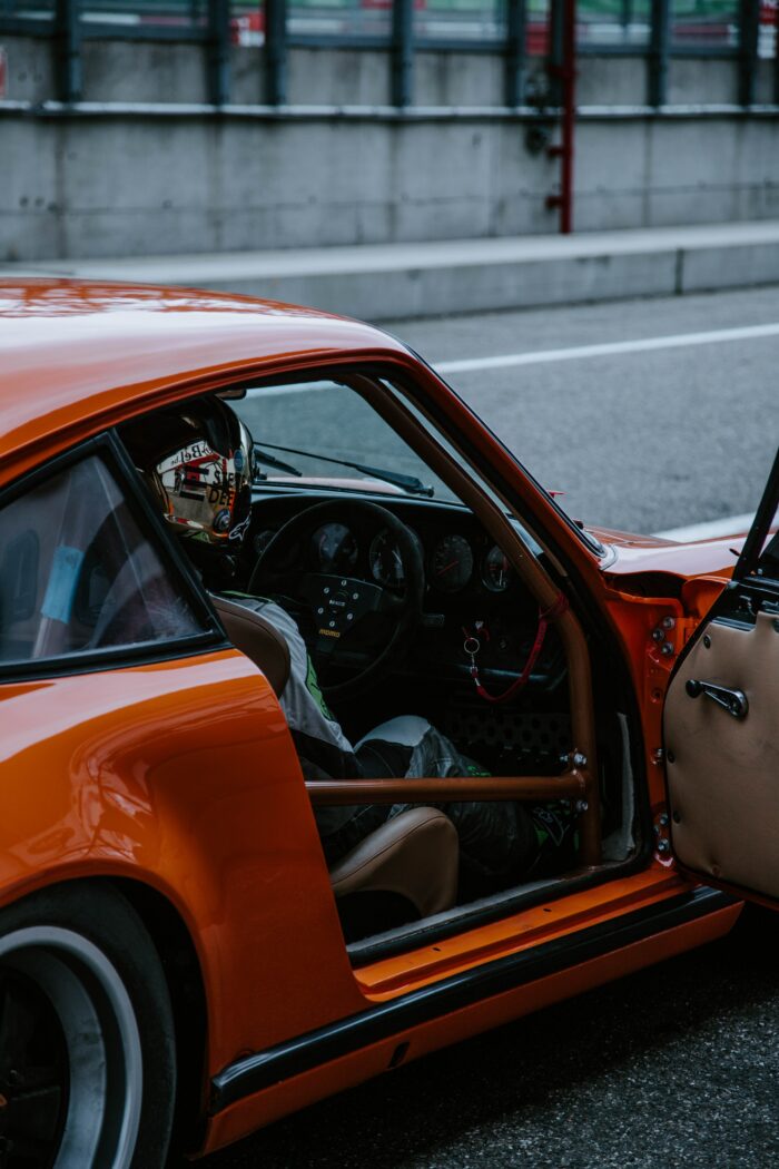 Car photography 101: A red sports car with an open door 