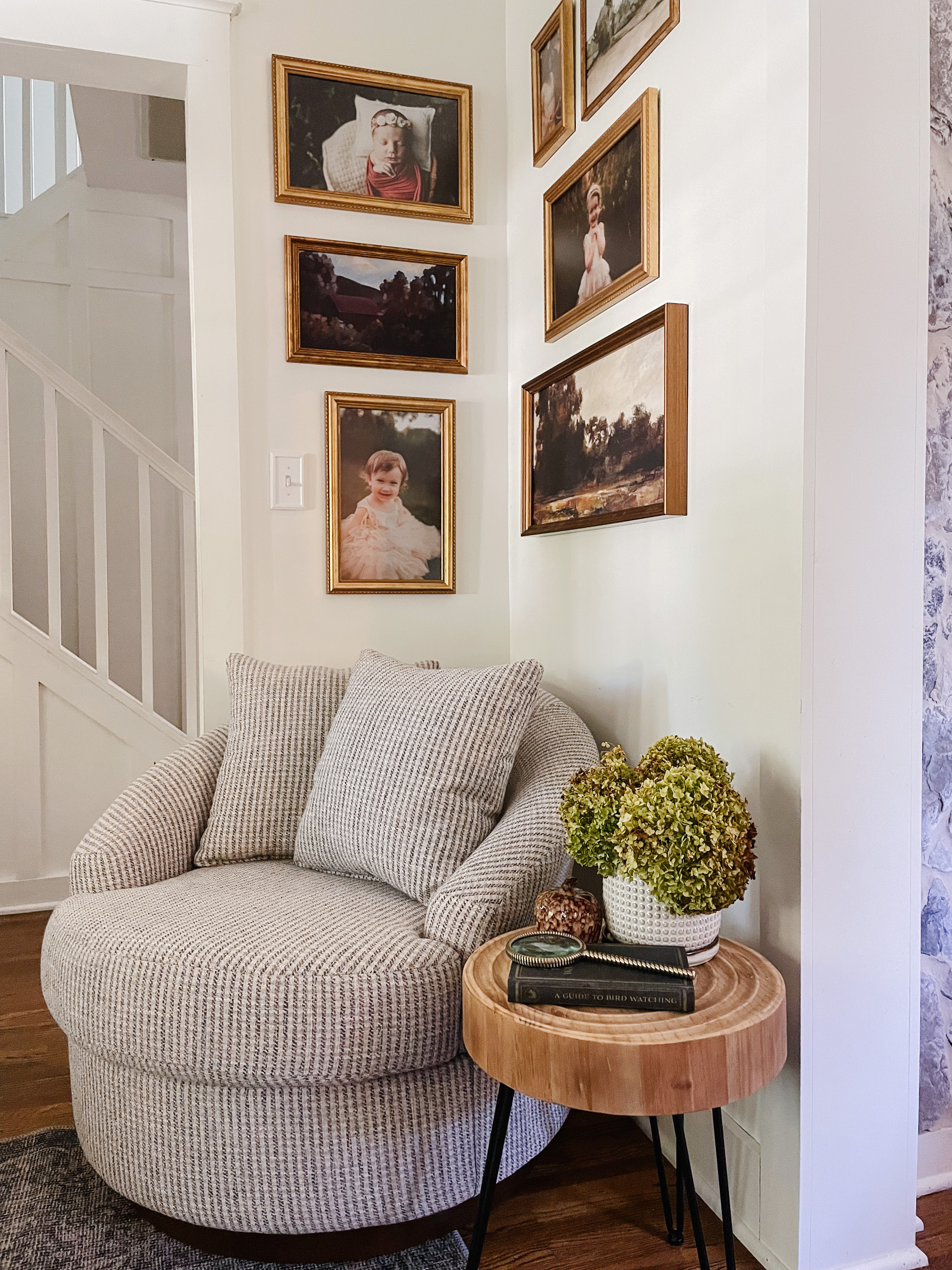 Photo Wall Ideas: Framed photos above an arm chair