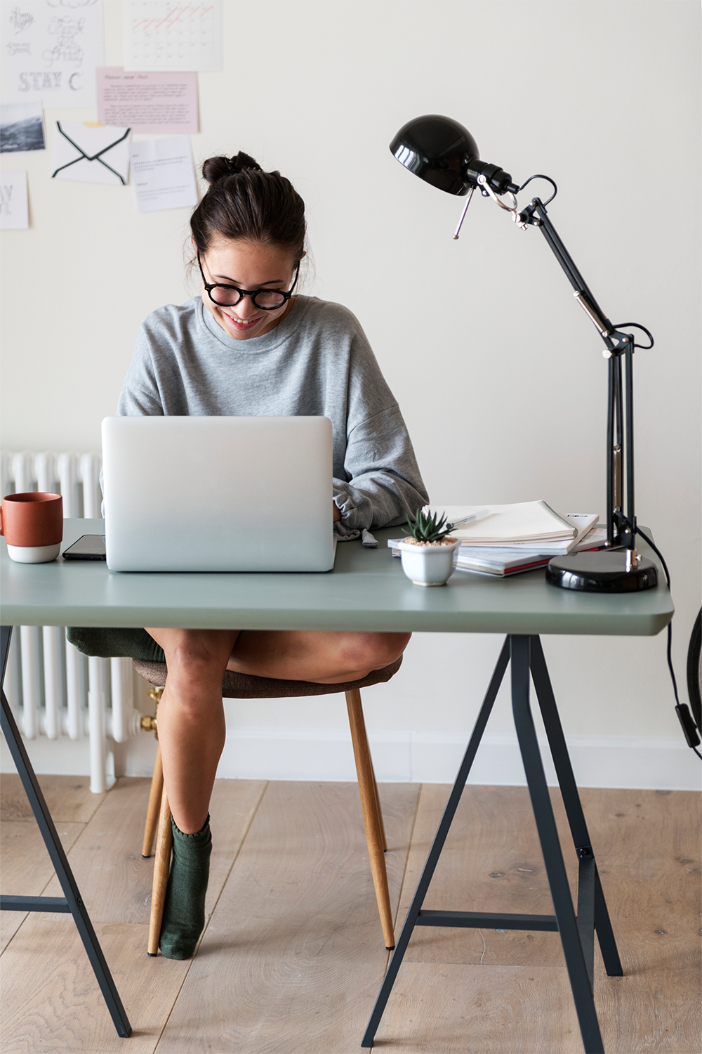 A woman typing on a computer 