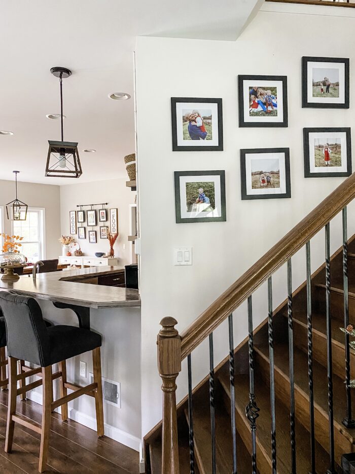 Picture Frame Arrangements: A family gallery wall following staircase lines