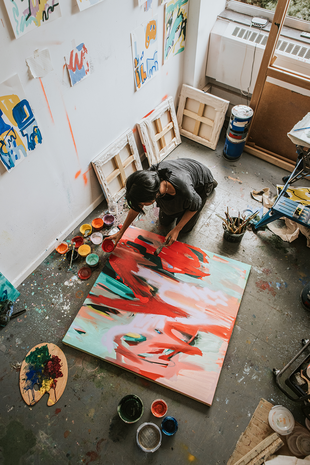 Ace Your Art Website's Product Page Design: A woman painting in her art studio