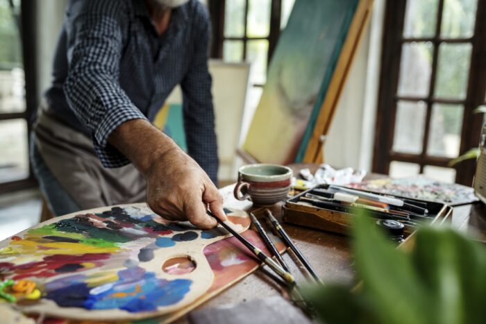 A man painting in his studio