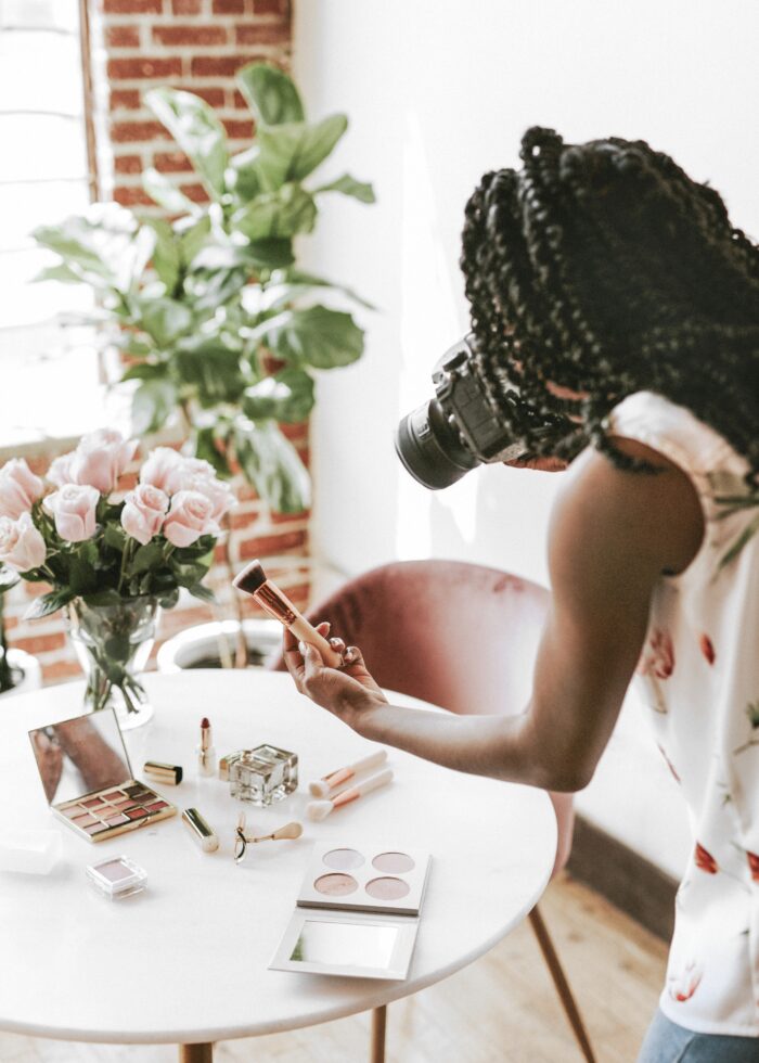 Increase freelance rates: A lady taking product photos