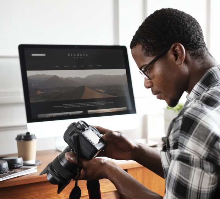 A man looking at photos 