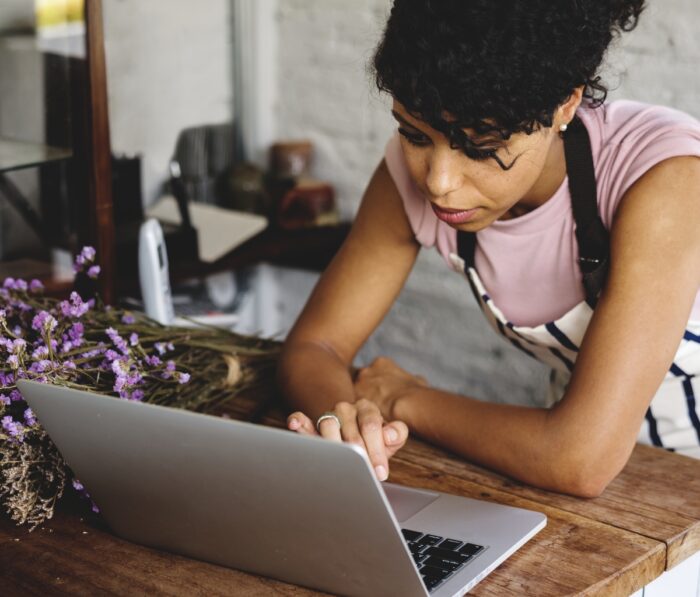 A lady working on her computer