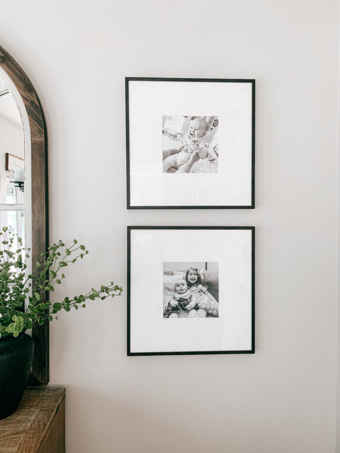 At Home Photoshoot: Two black and white photos on a wall. 