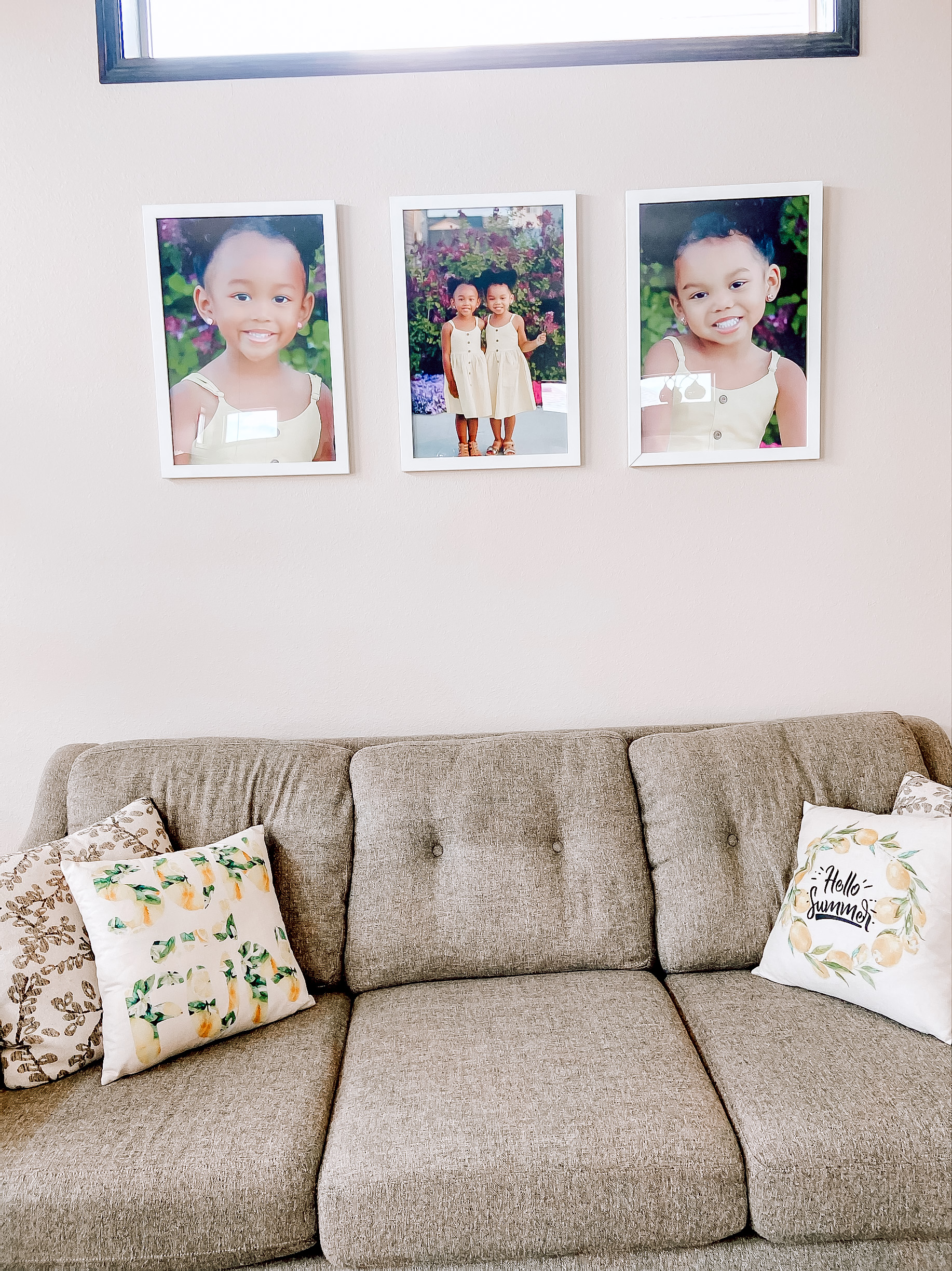 At Home Photoshoot: A family photoshoot taken a backyard garden, hung above a couch. 