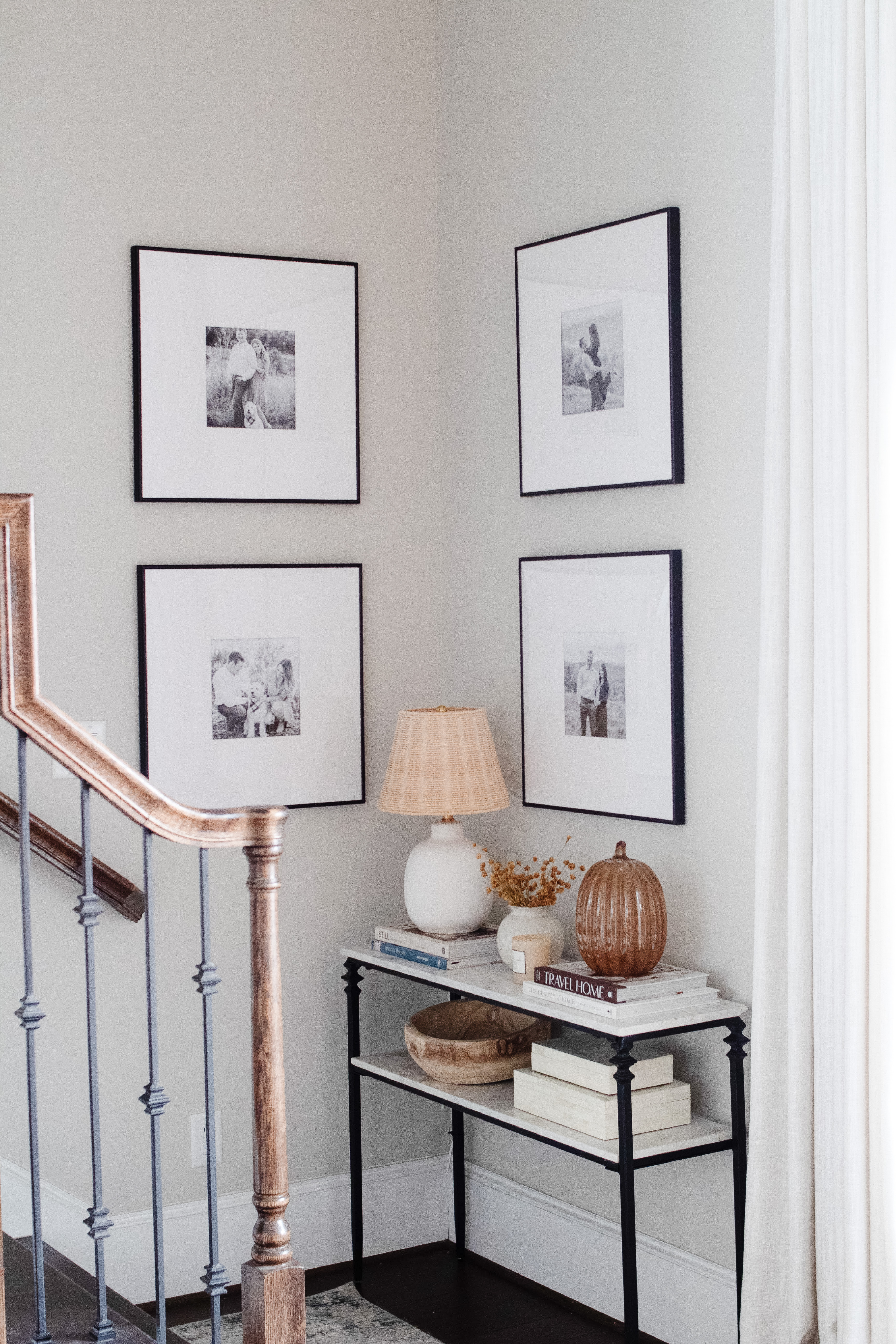 Unique Engagement Photo Ideas for Unforgettable Memories: Engagement photos hanging in a corner hallway