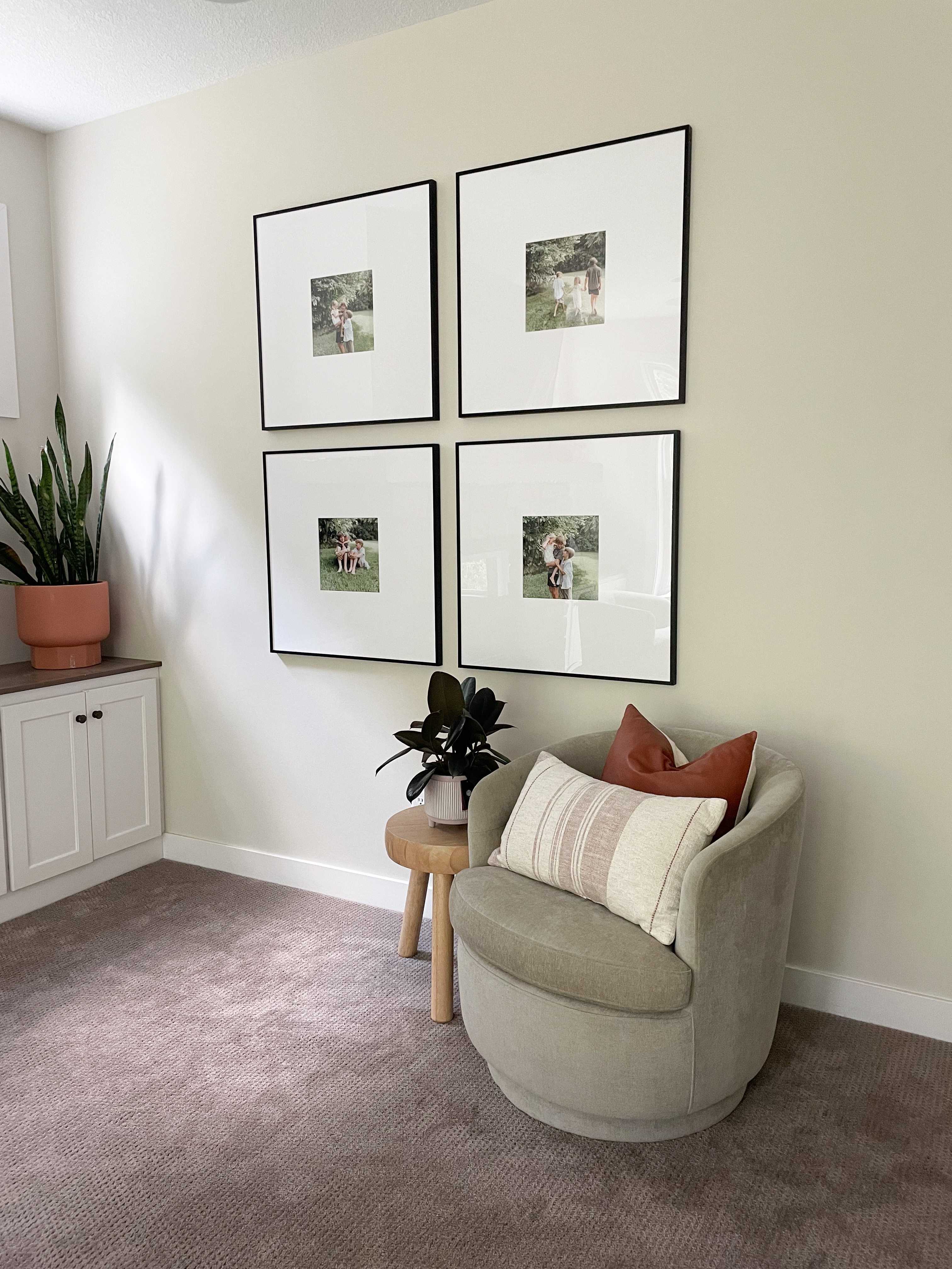 Save Money on Custom Framing: Family photos framed in a decorative living space. 