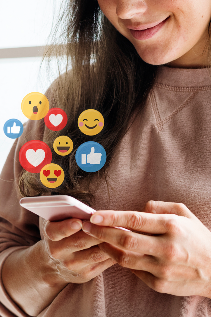 Promote Your Creative Work: A woman using social media on her phone