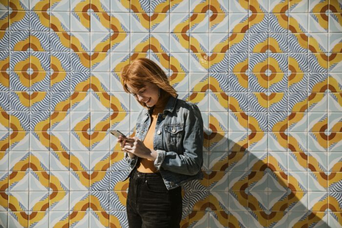 A woman using her phone to check social media