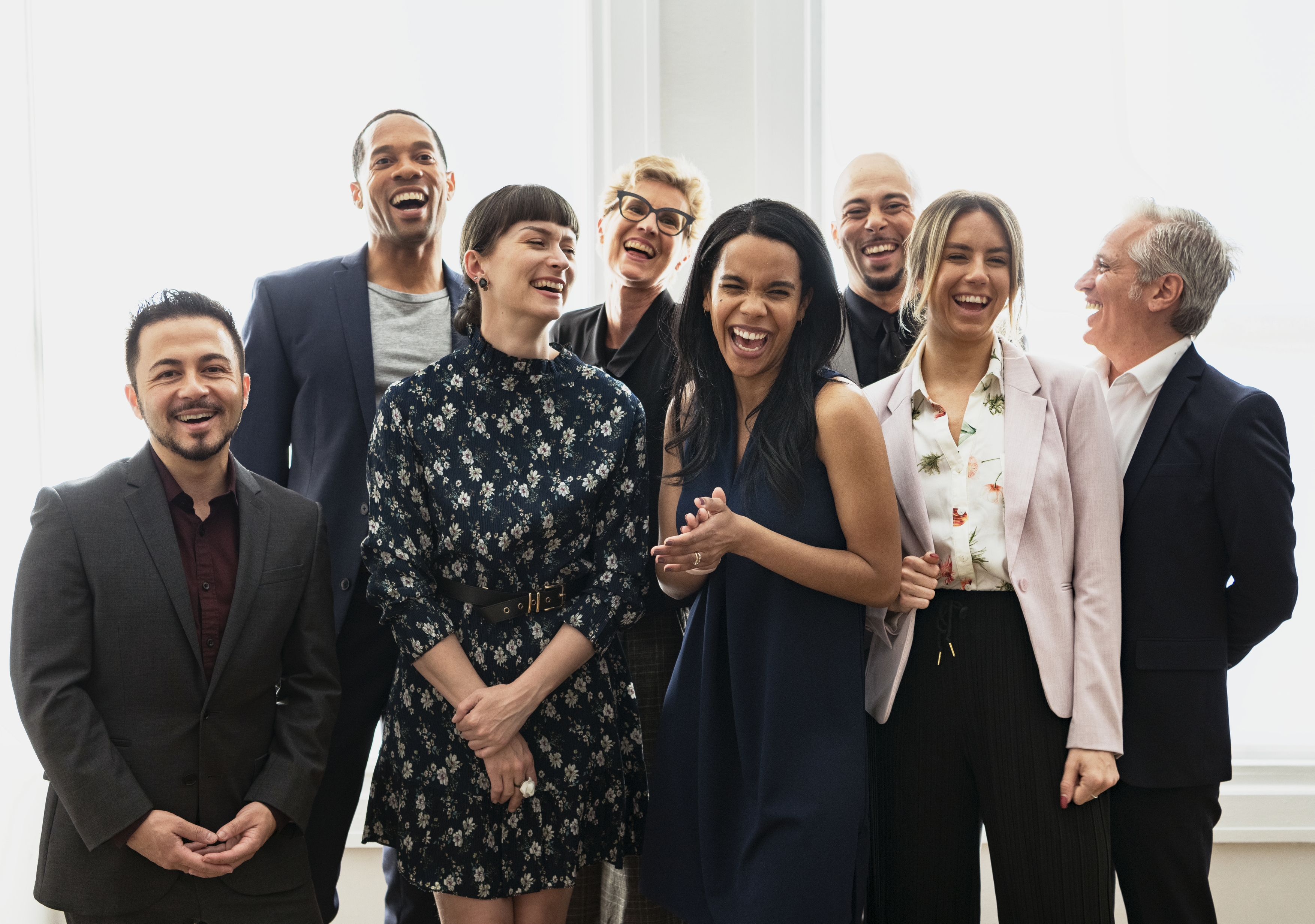 Happy diverse business people standing together