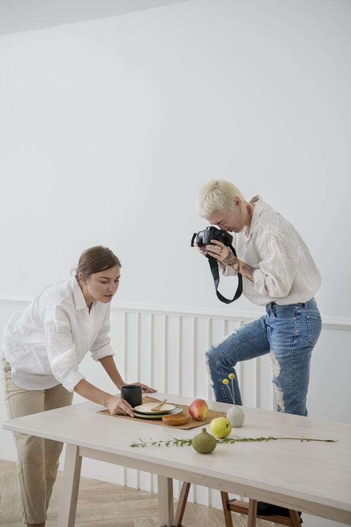 Blogger photographing plate decor 